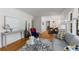 Open-concept living room flows into the dining area, featuring hardwood floors and modern decor at 404 Bridlewood Cir, Decatur, GA 30030