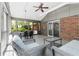 Bright sunroom with brick accent wall, comfortable seating and lots of natural light at 404 Bridlewood Cir, Decatur, GA 30030