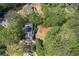 Aerial view of home with backyard, driveway and mature trees at 5251 Amberbrook Ct, Marietta, GA 30068