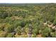 Aerial view showing the wooded surroundings of the home in a desirable neighborhood at 5251 Amberbrook Ct, Marietta, GA 30068