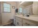 Bright bathroom showcasing a vanity with ample storage, large mirror and coordinated decor at 5251 Amberbrook Ct, Marietta, GA 30068