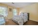 Cozy bedroom with a queen bed, bright window, and classic decor elements at 5251 Amberbrook Ct, Marietta, GA 30068