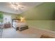 Comfortable bedroom with neutral decor, a bench seat, and great natural light at 5251 Amberbrook Ct, Marietta, GA 30068
