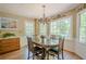 Inviting breakfast nook with large windows, wainscoting, and a charming chandelier at 5251 Amberbrook Ct, Marietta, GA 30068
