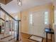 Elegant foyer with hardwood floors, a white front door, and stairs with a decorative railing at 5251 Amberbrook Ct, Marietta, GA 30068