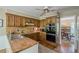 Kitchen with double sink, natural wood countertops, stainless oven, and eating area beyond at 5251 Amberbrook Ct, Marietta, GA 30068