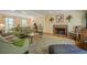 Spacious living room with a brick fireplace, plush seating, and abundant natural light at 5251 Amberbrook Ct, Marietta, GA 30068