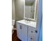 Bathroom vanity featuring white cabinets, modern fixtures and a bright white subway tiled shower at 795 Hammond Dr # 1908, Atlanta, GA 30328