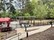 Community grilling and picnic area with multiple grills, picnic tables and a fire pit at 795 Hammond Dr # 1908, Atlanta, GA 30328
