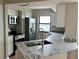 Modern kitchen featuring stainless steel appliances, granite countertops, and a stylish faucet at 795 Hammond Dr # 1908, Atlanta, GA 30328