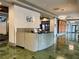 Park Towers lobby showcasing a reception desk, tiled flooring, and modern lighting at 795 Hammond Dr # 1908, Atlanta, GA 30328