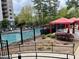 Community pool featuring a relaxing lounge area and lush landscaping at 795 Hammond Dr # 1908, Atlanta, GA 30328