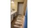Hall bathroom featuring a white vanity and a white door at 1491 Bellsmith Dr, Alpharetta, GA 30076
