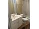 Bathroom featuring a shower-tub combination, a sink, and a white toilet at 1491 Bellsmith Dr, Alpharetta, GA 30076