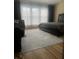 Bright bedroom featuring large window with sheer curtains and hardwood floor at 1491 Bellsmith Dr, Alpharetta, GA 30076