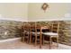 Cozy dining area has a wooden table with four chairs set against a decorative accent wall at 1491 Bellsmith Dr, Alpharetta, GA 30076