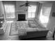 Bright living room showcasing a cozy fireplace, hardwood floors, large windows, and a comfortable sectional sofa at 1491 Bellsmith Dr, Alpharetta, GA 30076
