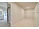 Walk-in closet with shelving and carpeted floor, with adjacent bath at 174 Haverling Pass, Hampton, GA 30252