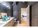 Bathroom featuring a double sink vanity and a glimpse into the bedroom at 195 Arizona Ne Ave # 203, Atlanta, GA 30307