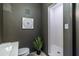Stylish bathroom features walk-in shower, gray walls, and modern artistic details, adding a touch of elegance at 195 Arizona Ne Ave # 203, Atlanta, GA 30307