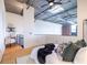 Modern bedroom with a unique ceiling, skylight, and an exposed brick wall at 195 Arizona Ne Ave # 203, Atlanta, GA 30307