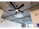 Unique ceiling with exposed metal beams, corrugated metal, and modern fan for an industrial chic feel at 195 Arizona Ne Ave # 203, Atlanta, GA 30307