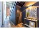 Stylish hallway with modern decor, sleek black door, and staircase at 195 Arizona Ne Ave # 203, Atlanta, GA 30307
