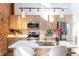 Modern kitchen with stainless steel appliances, a large island and exposed brick accent wall at 195 Arizona Ne Ave # 203, Atlanta, GA 30307