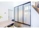 Bright living area features concrete floors, large frosted glass sliding doors, and stairs to upper level at 195 Arizona Ne Ave # 203, Atlanta, GA 30307