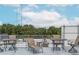 Relaxing rooftop deck showcasing lounge chairs, tables, and stunning views of the surrounding city at 195 Arizona Ne Ave # 203, Atlanta, GA 30307