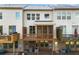 Exterior view of the back of the townhome with decks and patios at 282 Autry Mill Ln, Suwanee, GA 30024