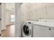 Functional laundry room with modern washer and dryer, providing convenience and efficiency for household tasks at 282 Autry Mill Ln, Suwanee, GA 30024