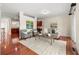 Open living space with hardwood floors, comfortable seating, and a seamless transition to the adjacent kitchen, ideal for entertaining at 282 Autry Mill Ln, Suwanee, GA 30024