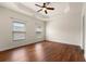 Spacious main bedroom with hardwood floors and tray ceiling, creating a luxurious and inviting retreat at 282 Autry Mill Ln, Suwanee, GA 30024