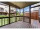 Spacious screened porch with wood flooring and open views, perfect for enjoying the outdoors in comfort at 282 Autry Mill Ln, Suwanee, GA 30024