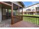 Relaxing screened porch with wood flooring and privacy screens, ideal for outdoor enjoyment and entertaining at 282 Autry Mill Ln, Suwanee, GA 30024