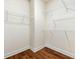 Spacious walk-in closet featuring wood floors and wire shelving at 282 Autry Mill Ln, Suwanee, GA 30024
