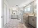 Bathroom showcasing a large glass-enclosed shower with tile, double vanity, and modern fixtures that offers a spa-like retreat at 2860 Windsor Knoll Dr, Dacula, GA 30019