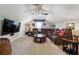 Large bonus room with a TV, fan, and sports memorabilia creating a relaxing and entertaining atmosphere at 2860 Windsor Knoll Dr, Dacula, GA 30019