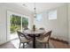 Cozy breakfast nook with a round table, natural light, and a view of the backyard at 2860 Windsor Knoll Dr, Dacula, GA 30019