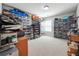 Spacious walk-in closet with rows of shelves and shoe storage containers, perfect for organization at 2860 Windsor Knoll Dr, Dacula, GA 30019