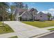 Beautiful two-story home with a long driveway and well-maintained landscaping at 2860 Windsor Knoll Dr, Dacula, GA 30019