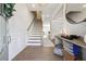 Bright foyer with hardwood floors, staircase, and stylish decor, offering a warm welcome at 2860 Windsor Knoll Dr, Dacula, GA 30019
