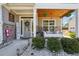 Inviting front porch with a porch swing, stone accents, and decorative welcome sign at 2860 Windsor Knoll Dr, Dacula, GA 30019