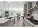 Spacious kitchen with a view of the living room and backyard, featuring modern appliances at 2860 Windsor Knoll Dr, Dacula, GA 30019