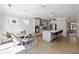 Bright kitchen with stainless steel appliances, an island, and an adjacent breakfast area at 2860 Windsor Knoll Dr, Dacula, GA 30019