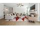 Bright living room featuring a ceiling fan, comfortable seating, stylish decor, and a fireplace with a TV above at 2860 Windsor Knoll Dr, Dacula, GA 30019