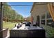 Comfortable outdoor living space with an outdoor patio set with furniture and strung lights at 3798 Spring Place Ct, Loganville, GA 30052