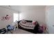 Small bedroom with whimsical wall art and a comfortable bed at 3798 Spring Place Ct, Loganville, GA 30052