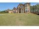 Inviting two-story home with brick accents, a manicured lawn, and mature trees at 3798 Spring Place Ct, Loganville, GA 30052